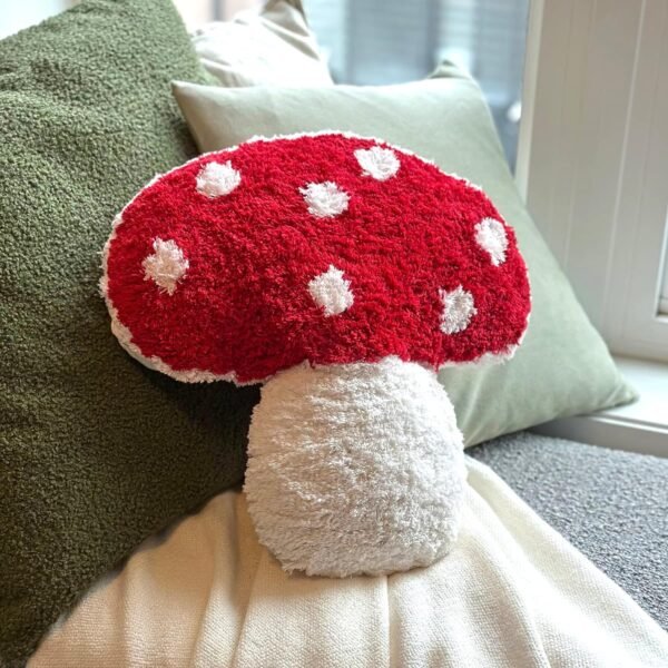 unique pillow in the shape of a mushroom